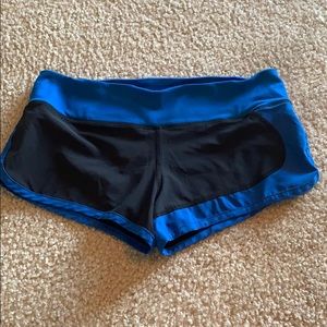 Black and blue running shorts, size small